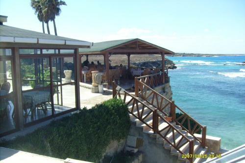 Hostal Oasis Beachfront Guest Rooms And Restaurant
