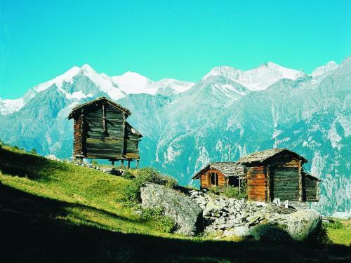 Brightly Lit Chalet In Mountains In Heremence