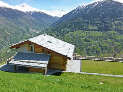 Brightly Lit Chalet In Mountains In Heremence