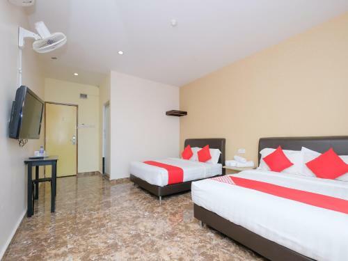 Hostal Oyo 89493 Q Hotel