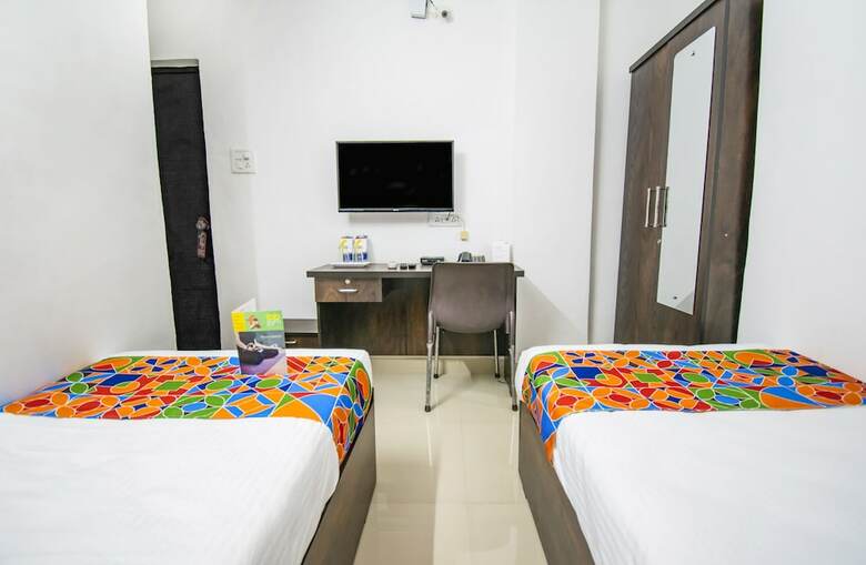 Fabhotel Purple Orchid