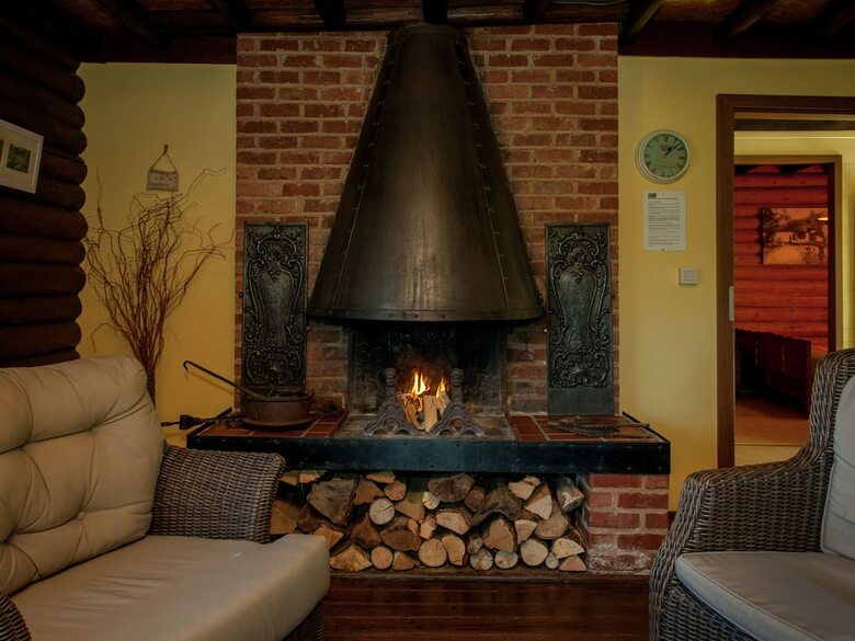 Open Wooden Chalet Built Against A Hill
