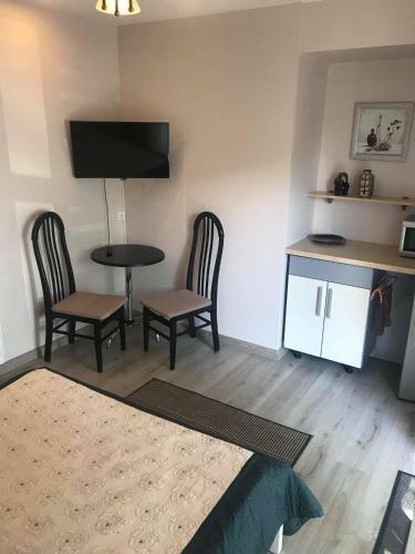 Apartamentai-ramus Poilsis