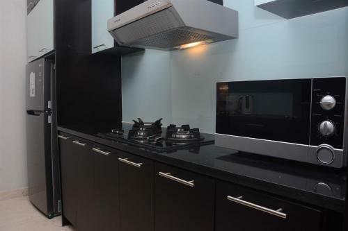 Comfy And Spacious 2br The Masterpiece Epicentrum Apartment By Travelio