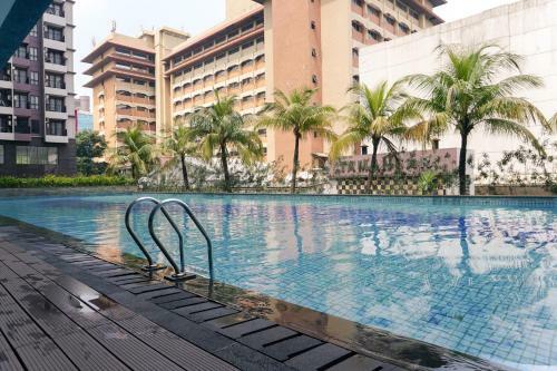 Comfy Studio Tamansari Semanggi Apartment By Travelio