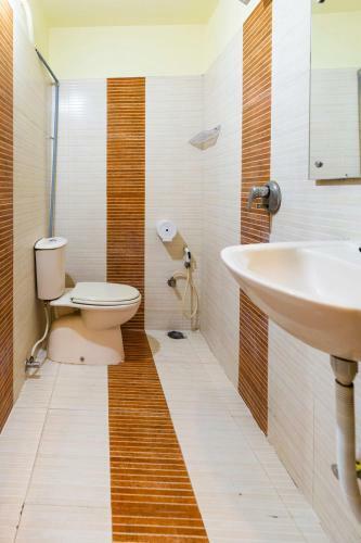 Hotel Capital O 67372 Garuda Suites
