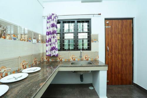 Hostal Oyo 77911 Heavenly Wayanad