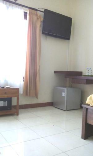 Hotel Taxa Inn Kuta Raya