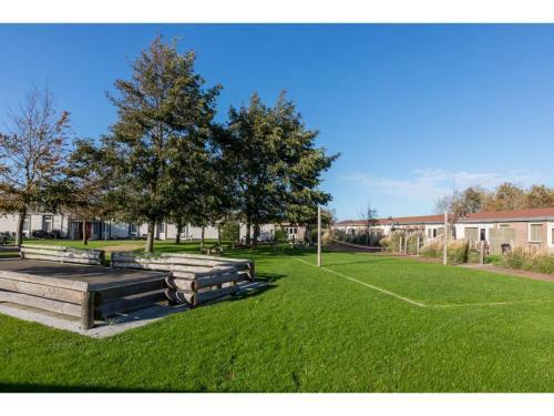 Family House On A Small Park With A Large Playing Field