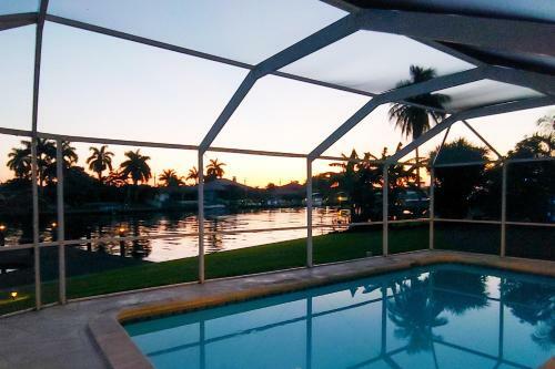 Canal-front Getaway With Heated Pool & Dock Home
