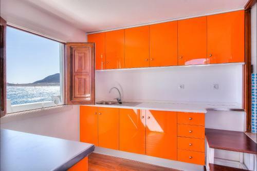 House Touching The Sea