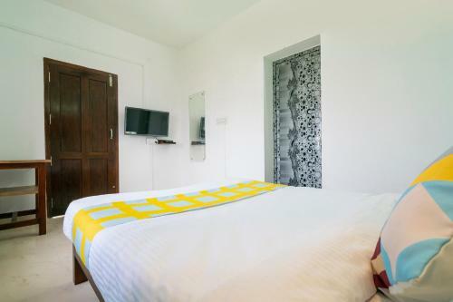 Hostal Oyo 79724 Tharayil Apartments