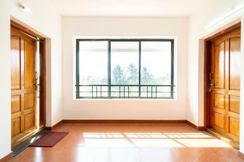 Hostal Oyo 79724 Tharayil Apartments
