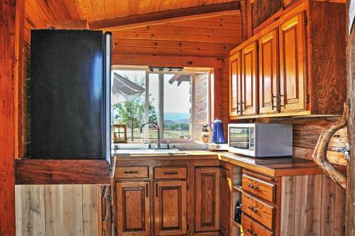 Remote Antimony Log Cabin With Green Meadow Views!