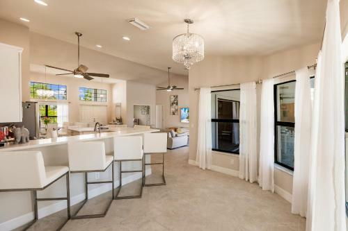 Waterfront Home With Golf Access & Heated Pool