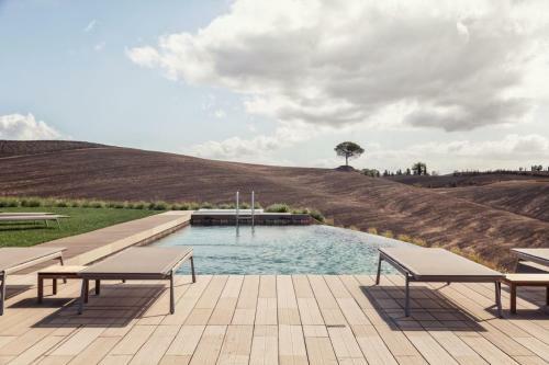A Swim In The Infinity Pool Or Relax In The Poolside Jacuzzi
