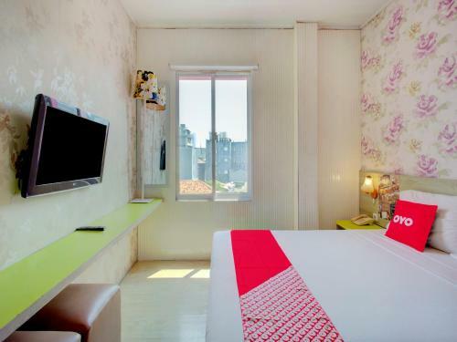 Capital O 4002 Aleander Hotel