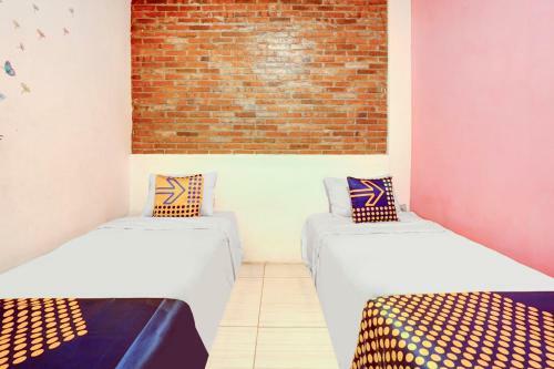 Hotel Spot On 90686 Griyapram Backpacker Syariah