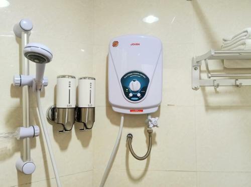 Oyo 90464 Borneo Suites Hotel