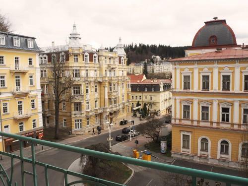 2 Balconies Above Colonnade Apartment