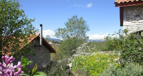 Amygdalia, A Stone House In A Quiet Landscape