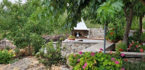 Amygdalia, A Stone House In A Quiet Landscape