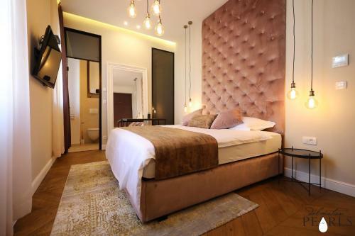 Apartamentos Three Pearls Deluxe Rooms