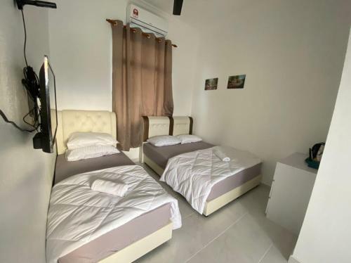Hostal Dsinggahpcb Guest House