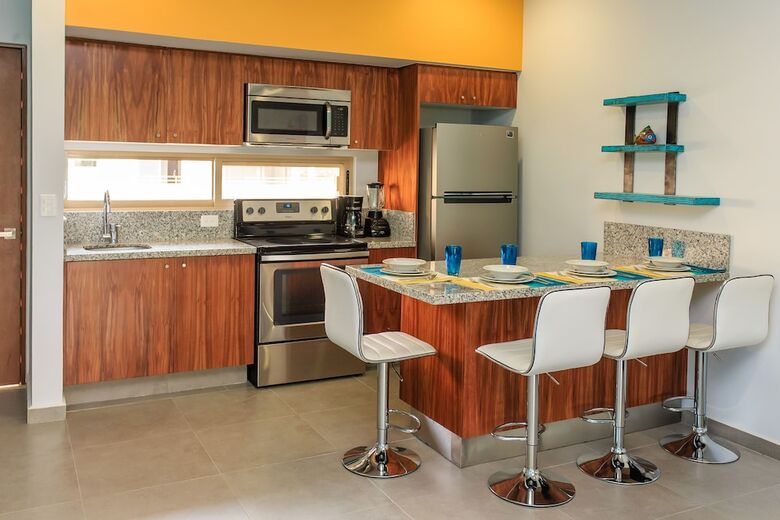 Apartamentos Condo Complex With An Alluring Pool & Tropical Vibes By Stella Rentals