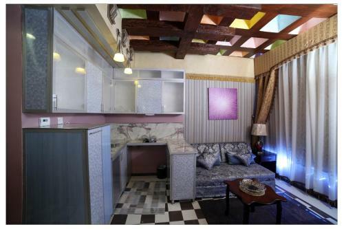 Apartamento Roomi Suites Hotel