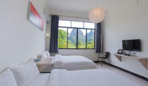 Bed & Breakfast Dragon's Den Hostel In Yangshuo