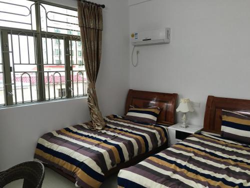 Apartamento Shuangyuewan Happy Inn