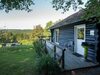 Open Wooden Chalet Built Against A Hill