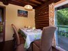 Open Wooden Chalet Built Against A Hill